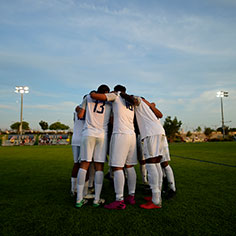 Soccer team huddling. Links to Gifts of Cash, Checks, and Credit Cards